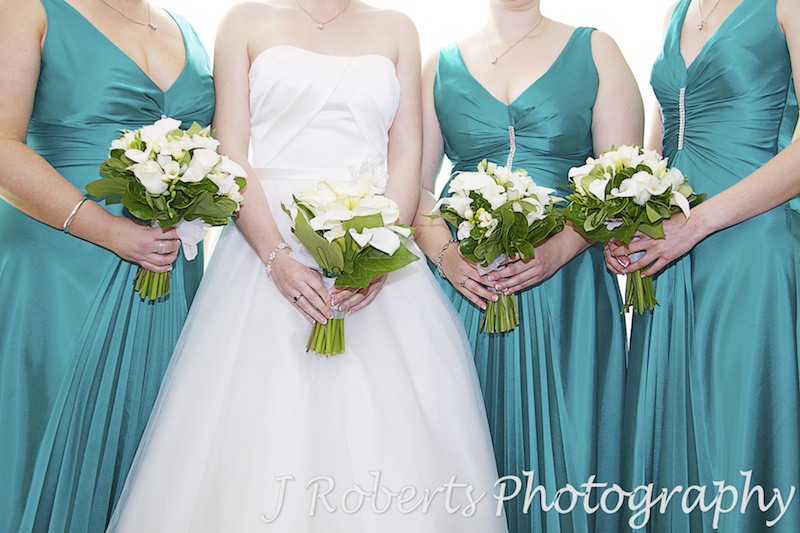Bride and bridesmaids holding bouquets - wedding photography sydney